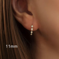 Vela Loop – Marquise Diamond Huggie Earrings